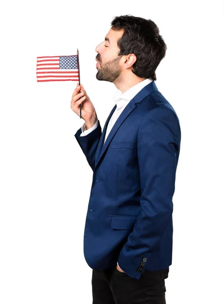 アメリカの国旗を保持しているハンサムな男 — ストック写真