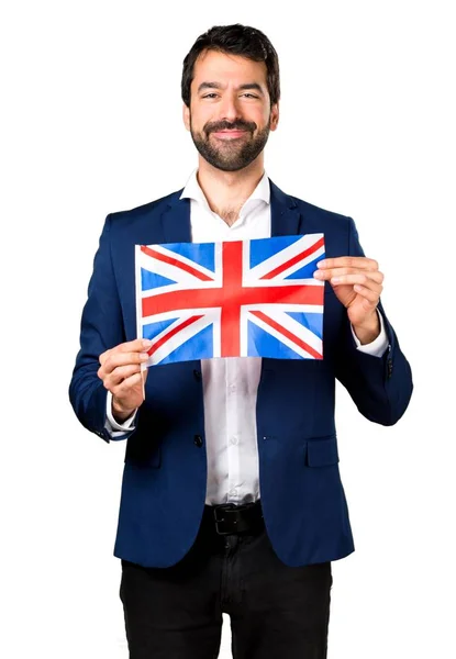 Hombre guapo sosteniendo una bandera británica —  Fotos de Stock