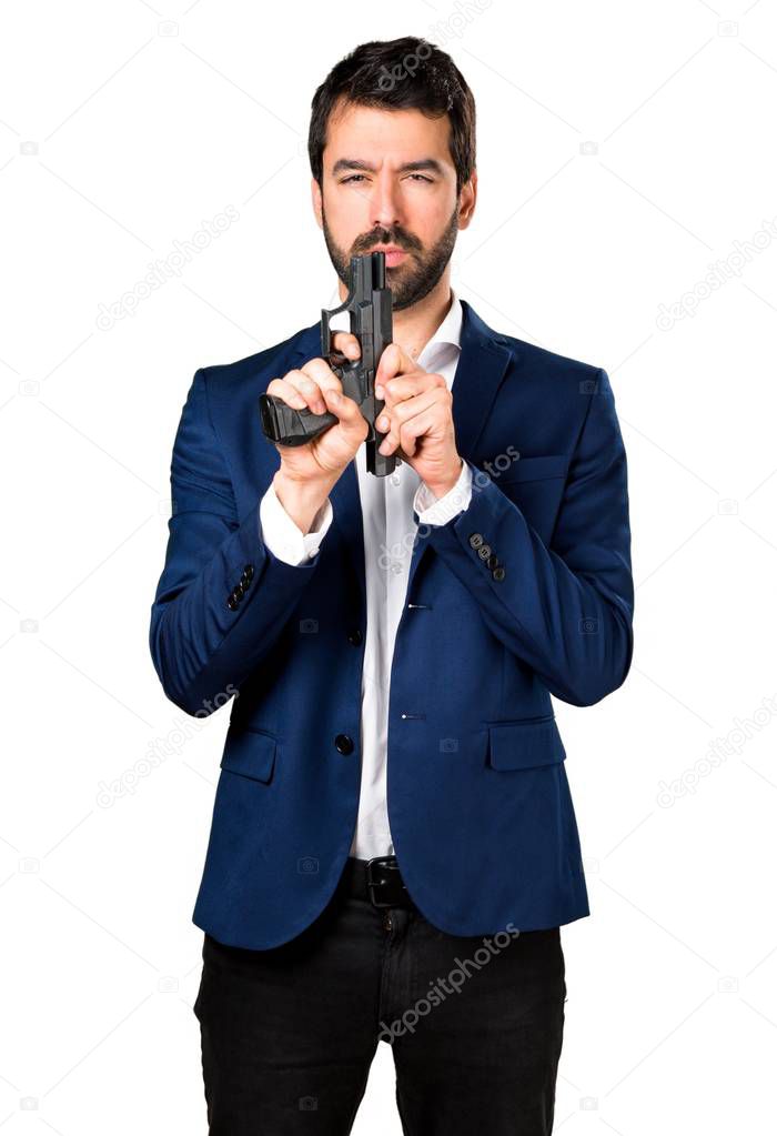 Handsome man holding a pistol