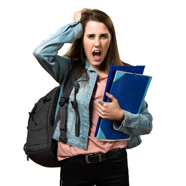 Frustrated teen student girl holding books — Stock Photo, Image