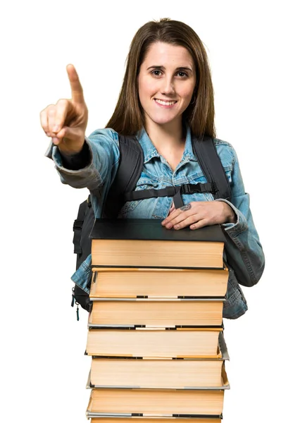 Ragazza adolescente studente con un sacco di libri e contando uno — Foto Stock