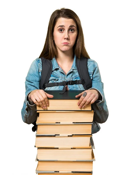 Triste adolescente estudiante chica con un montón de libros — Foto de Stock