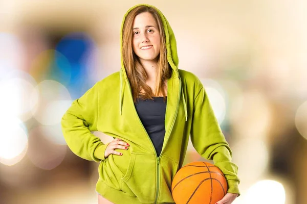 Pretty young girl wearing urban style with basketball — Stock Photo, Image