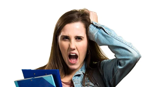Frustrated teen student girl holding books — Stock Photo, Image