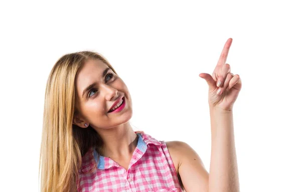 Blond flicka pekar uppåt — Stockfoto