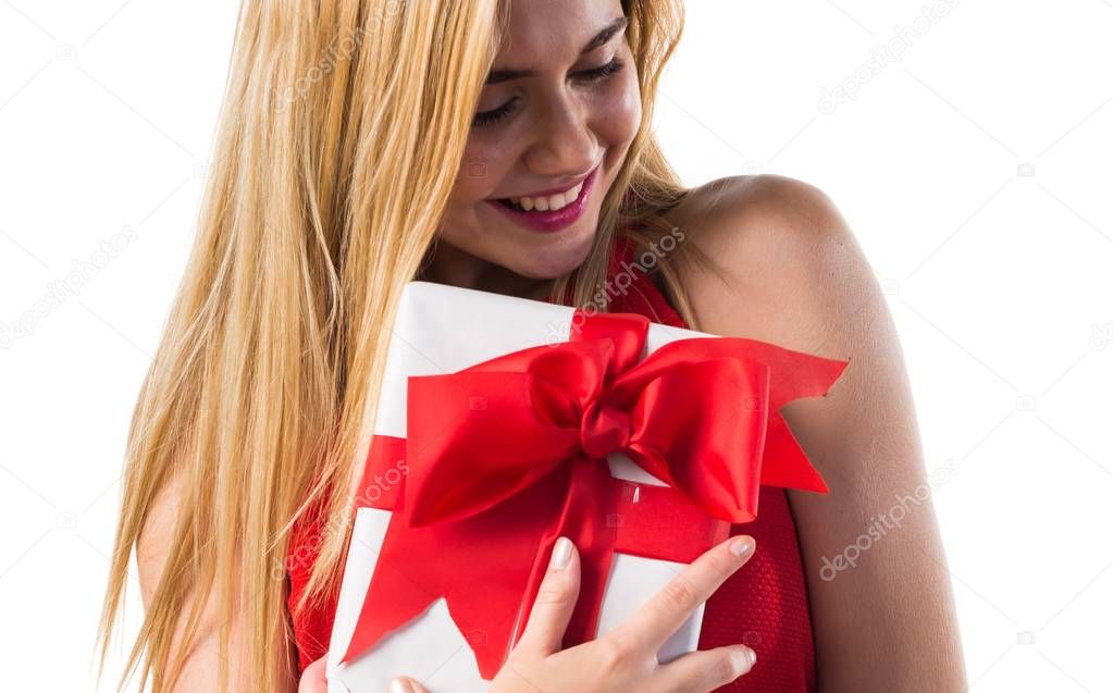 Blonde girl holding a gift