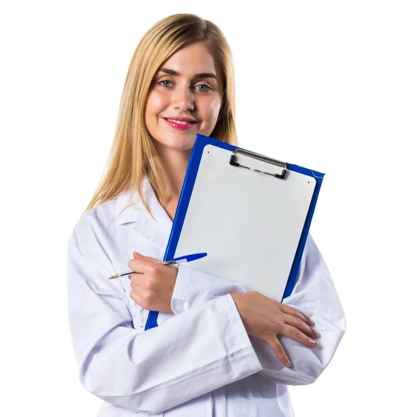 Läkare kvinna anläggning anteckningar — Stockfoto