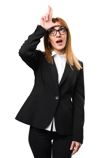 Young business woman making loser sign — Stock Photo, Image