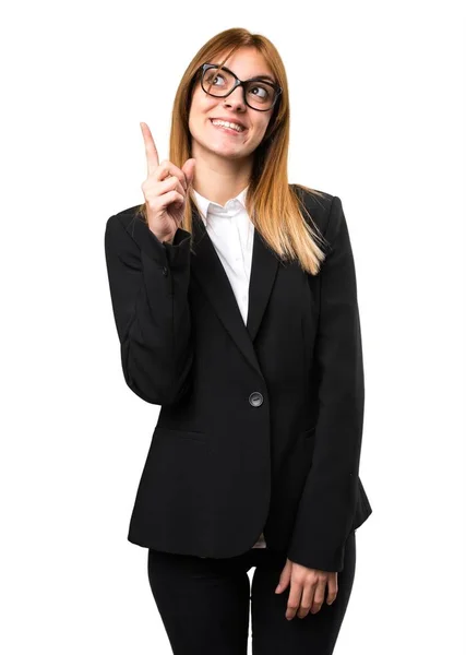 Young business woman pointing up — Stock Photo, Image