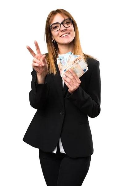 Fiatal üzleti nő vesz egy csomó pénzt — Stock Fotó