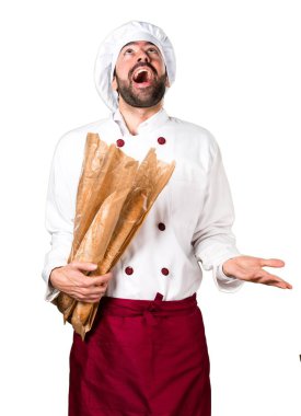 Biraz ekmek tutarak ve yalvaran genç baker