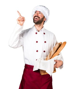 Biraz ekmek tutarak ve düşünme genç baker