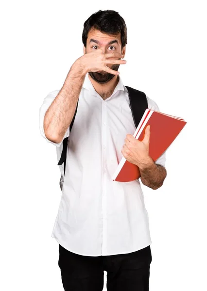 Student man making smelling bad gesture