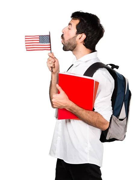 Studente uomo in possesso di una bandiera americana — Foto Stock