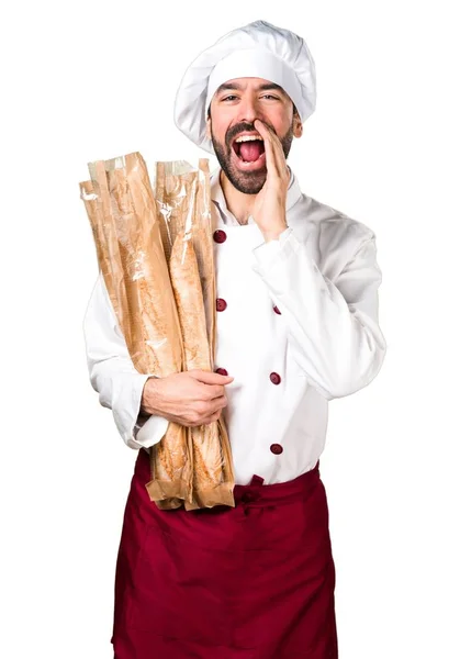 Unga bagare håller vissa bröd och skrika — Stockfoto