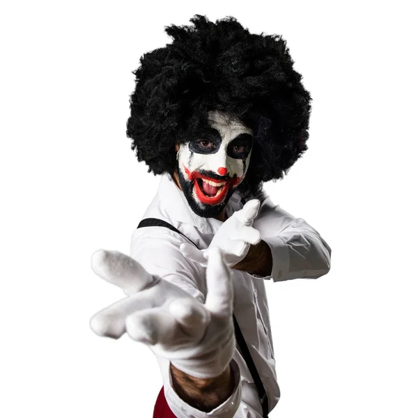 Killer-Clown präsentiert etwas — Stockfoto