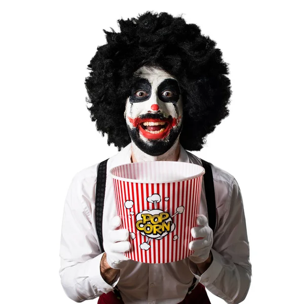 Killer clown eten popcorns — Stockfoto