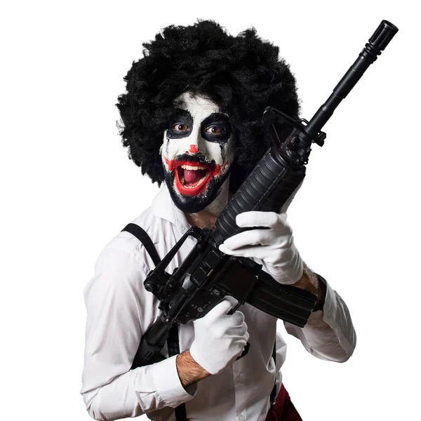 Payaso asesino sosteniendo un rifle — Foto de Stock