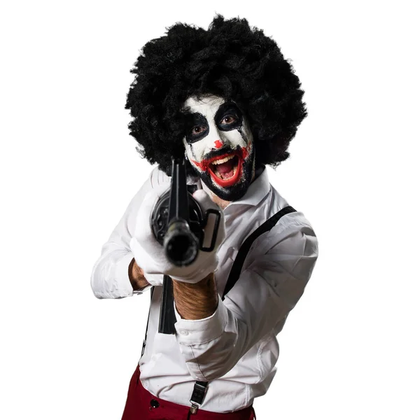 Payaso asesino sosteniendo un rifle — Foto de Stock