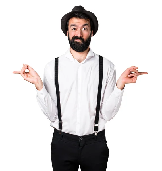 Hipster człowieka z brodą, wskazując przykanalików, mając wątpliwości — Zdjęcie stockowe