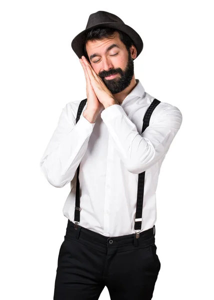 Hipster hombre con barba haciendo el gesto del sueño —  Fotos de Stock