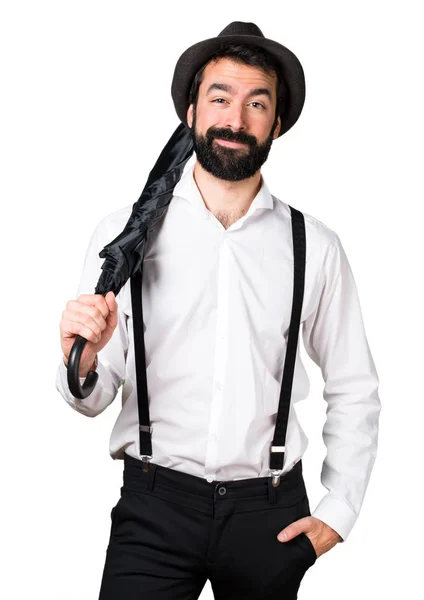 Hipster man with beard holding an umbrella — Stock Photo, Image