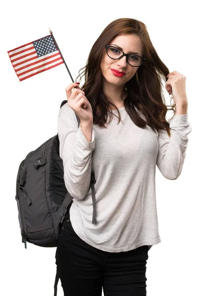 アメリカの国旗を保持している学生女性 — ストック写真