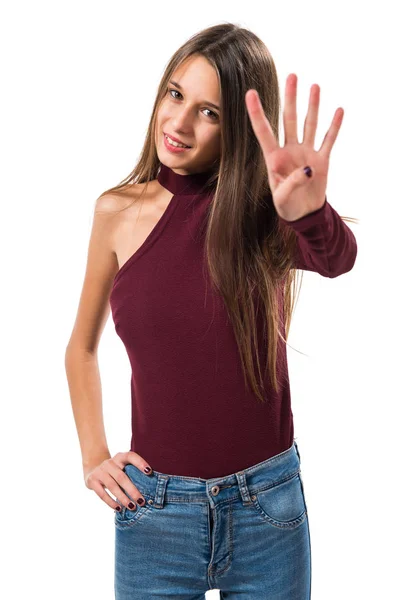 Joven adolescente contando cuatro — Foto de Stock