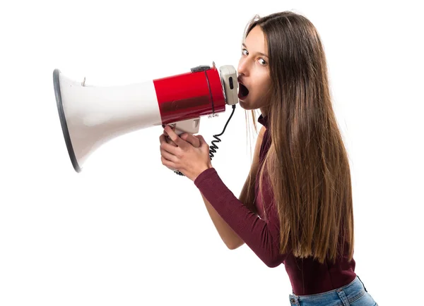 Young teenager girl shouting by megaphone — Stock Photo, Image