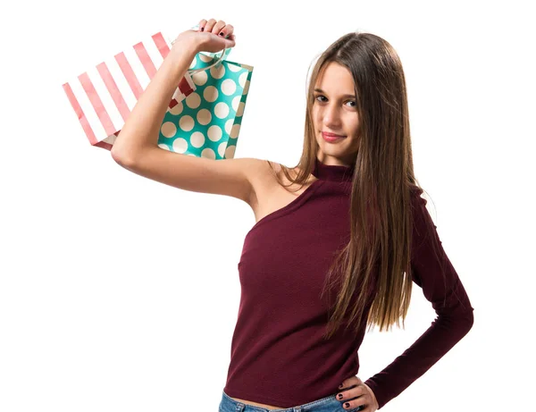 Jovem adolescente com muitos sacos de compras — Fotografia de Stock