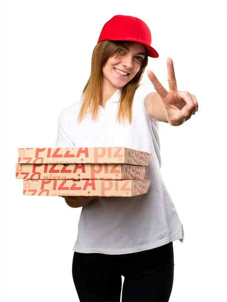Mulher de entrega de pizza fazendo gesto de vitória — Fotografia de Stock