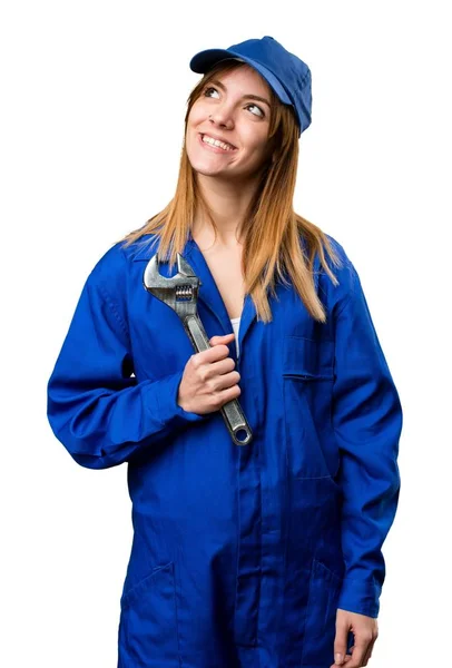 Delivery woman looking up — Stock Photo, Image