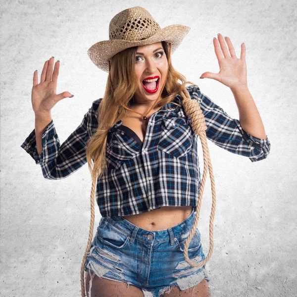 Sexy blonde woman cowgirl making surprise gesture — Stock Photo, Image