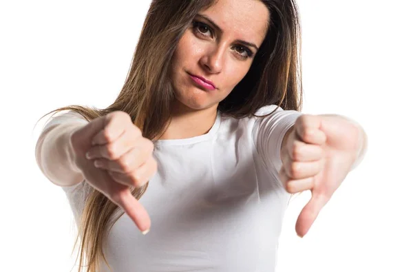 Young pretty girl making bad signal — Stock Photo, Image