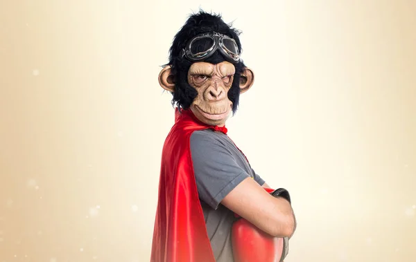 Superhero monkey man on ocher background