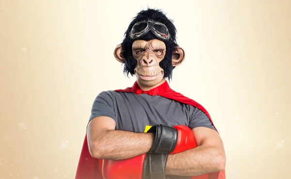 Superhero monkey man on ocher background