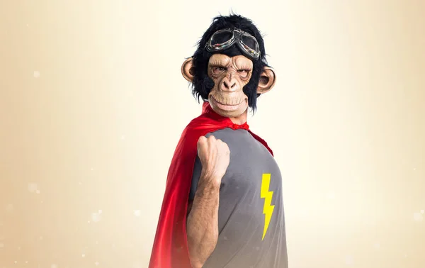 Lucky Superhero monkey man on ocher background