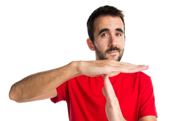 Brunette-mann som gjør en timeout-gest – stockfoto