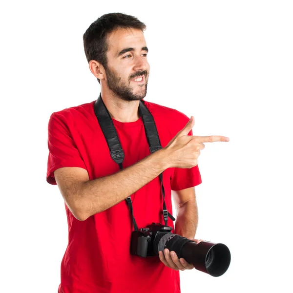 Photographer man pointing to the lateral — Stock Photo, Image