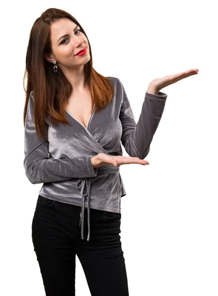 Beautiful young girl presenting something — Stock Photo, Image