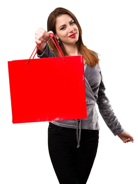 Krásná mladá dívka s nákupní taškou — Stock fotografie