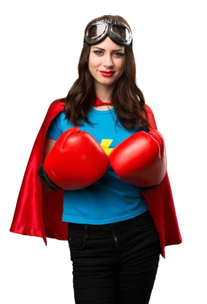 Menina super-herói bonita com luvas de boxe — Fotografia de Stock