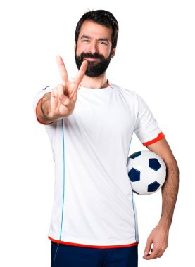 Zafer jest yapma bir futbol topu futbol oyuncu