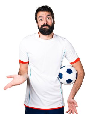Önemsiz bir jest yapma bir futbol topu futbol oyuncu