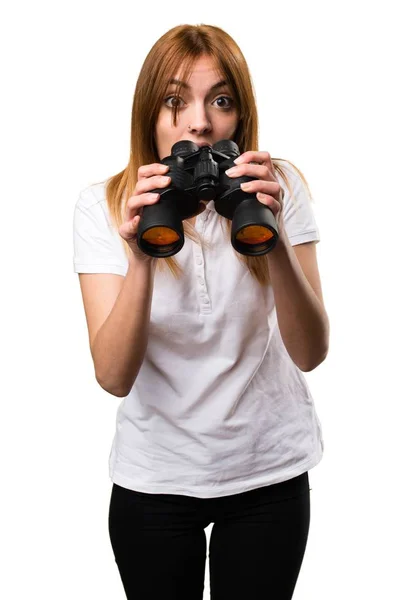 Surprised Beautiful young girl with binoculars — Stock Photo, Image