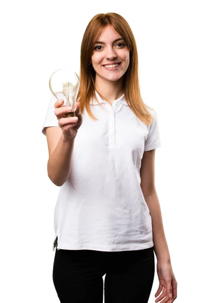 Happy Beautiful young girl holding a bulb — Stock Photo, Image