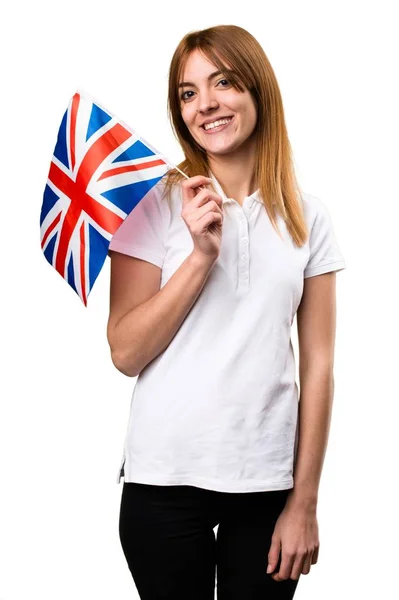 快乐的美丽的年轻的女孩，抱着英国国旗 — 图库照片