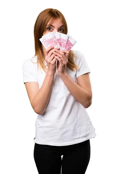 Hermosa joven tomando un montón de dinero — Foto de Stock