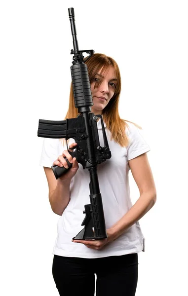 Gadis muda yang cantik memegang senapan — Stok Foto