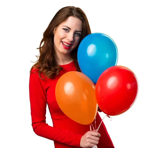 Feliz hermosa joven sosteniendo globos — Foto de Stock